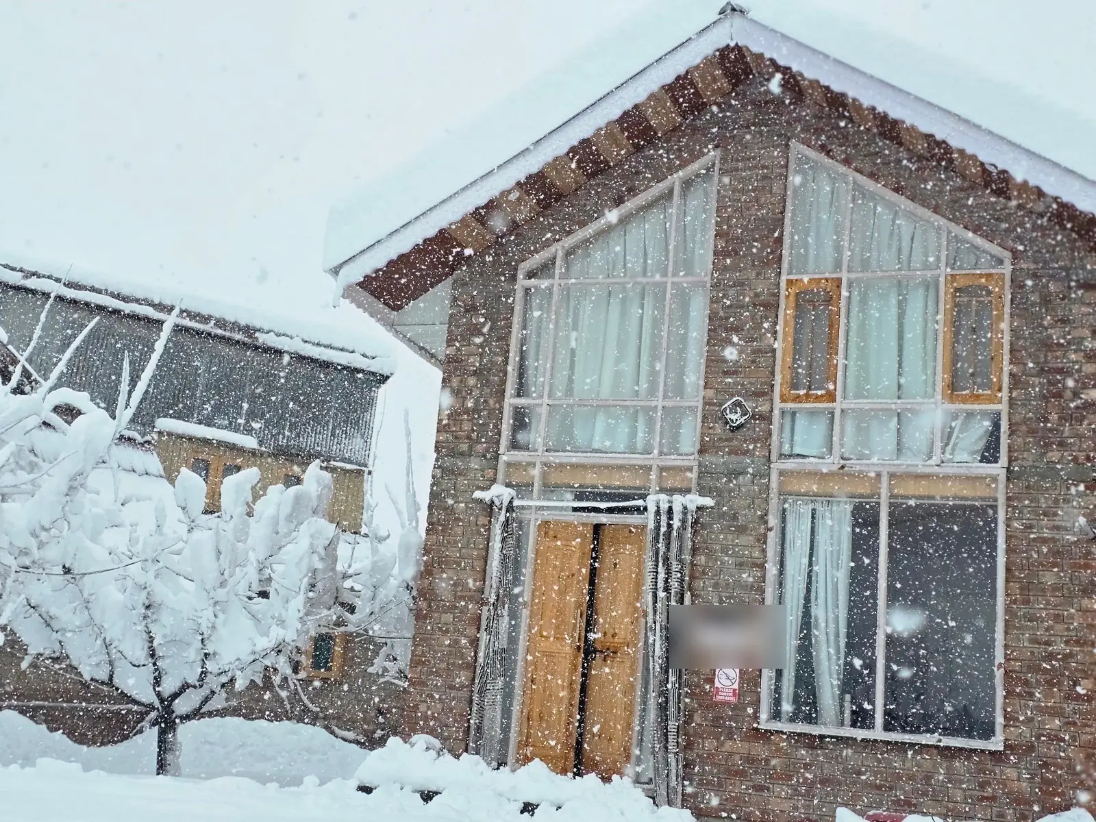 A Kashmiri cottage under fresh snow in Gulmarg